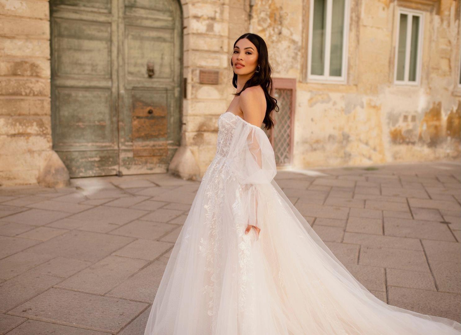 Photo of model wearing a white Eleganza Sposa Wedding Dress in Glasgow, UK