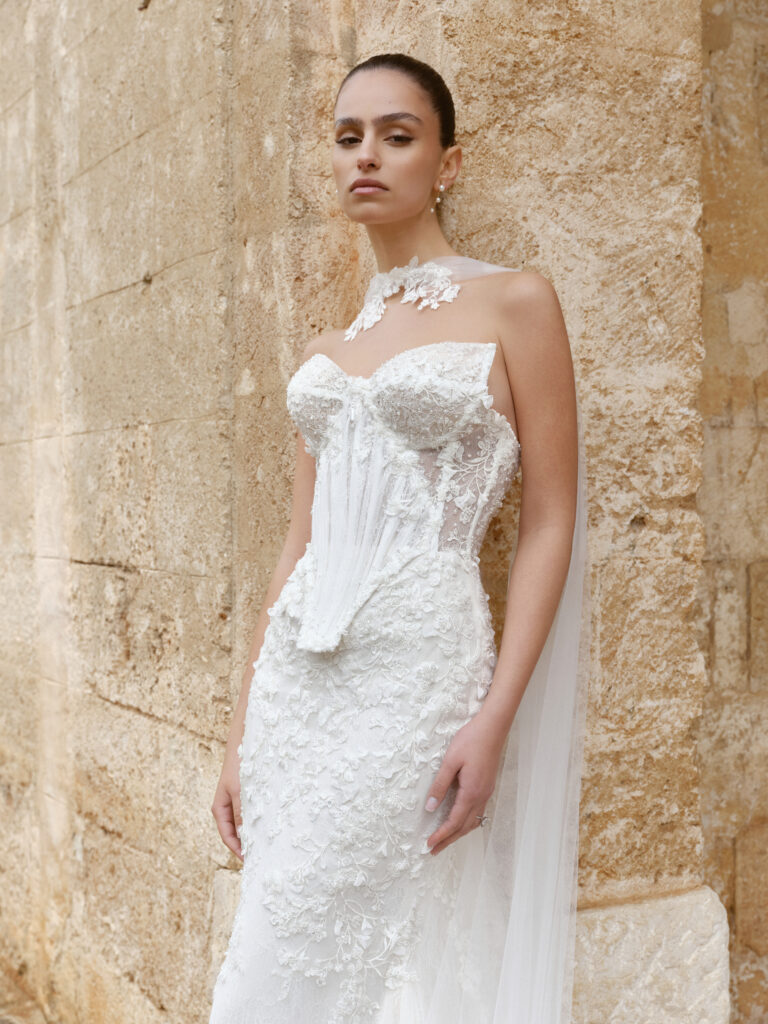 Ti Amo bridal gown front view with sculpted cups, elongated corset bodice and floral appliqué