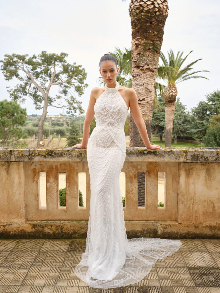 Baci wedding dress full front view with halter neckline, fitted shape and pearl embellished train