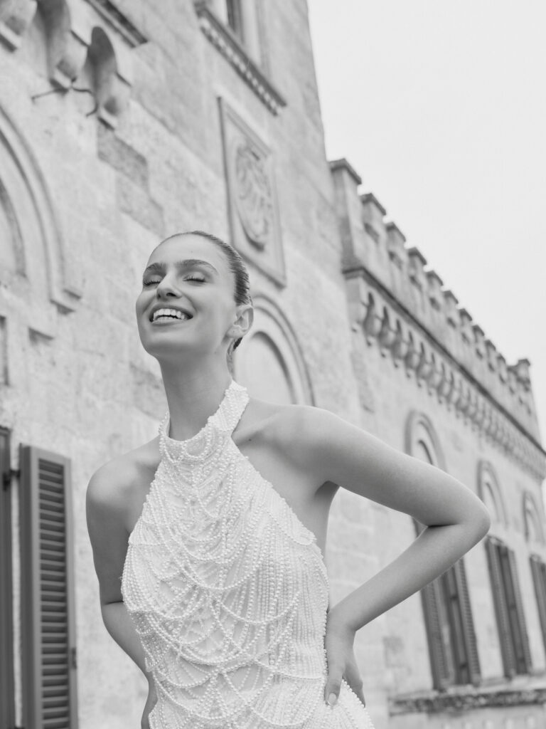 Baci bridal gown close-up showing high neckline and layered pearl detailing
