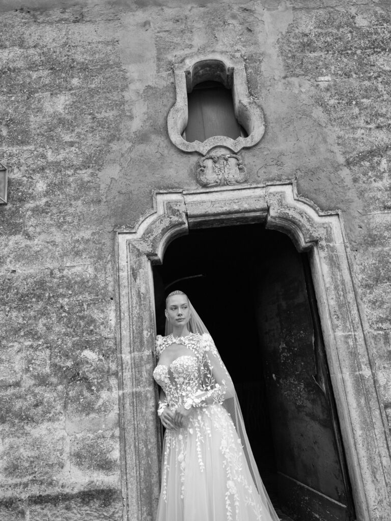 Anima Mia wedding dress full length with long sleeves and flowing tulle skirt