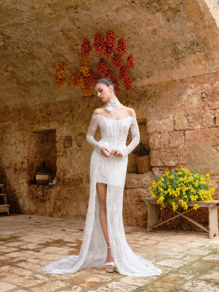 Amore Mio bridal gown back view showing fitted mini base and sheer lace overskirt