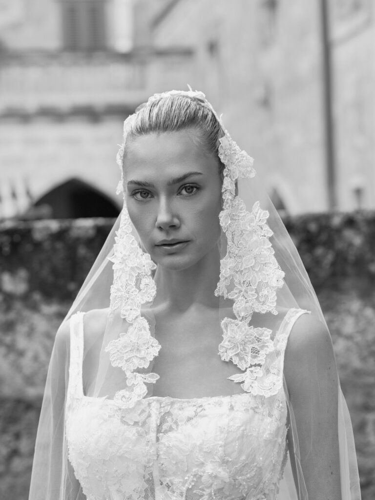 Adora wedding dress front view showing square neckline, floral lace bodice and veil