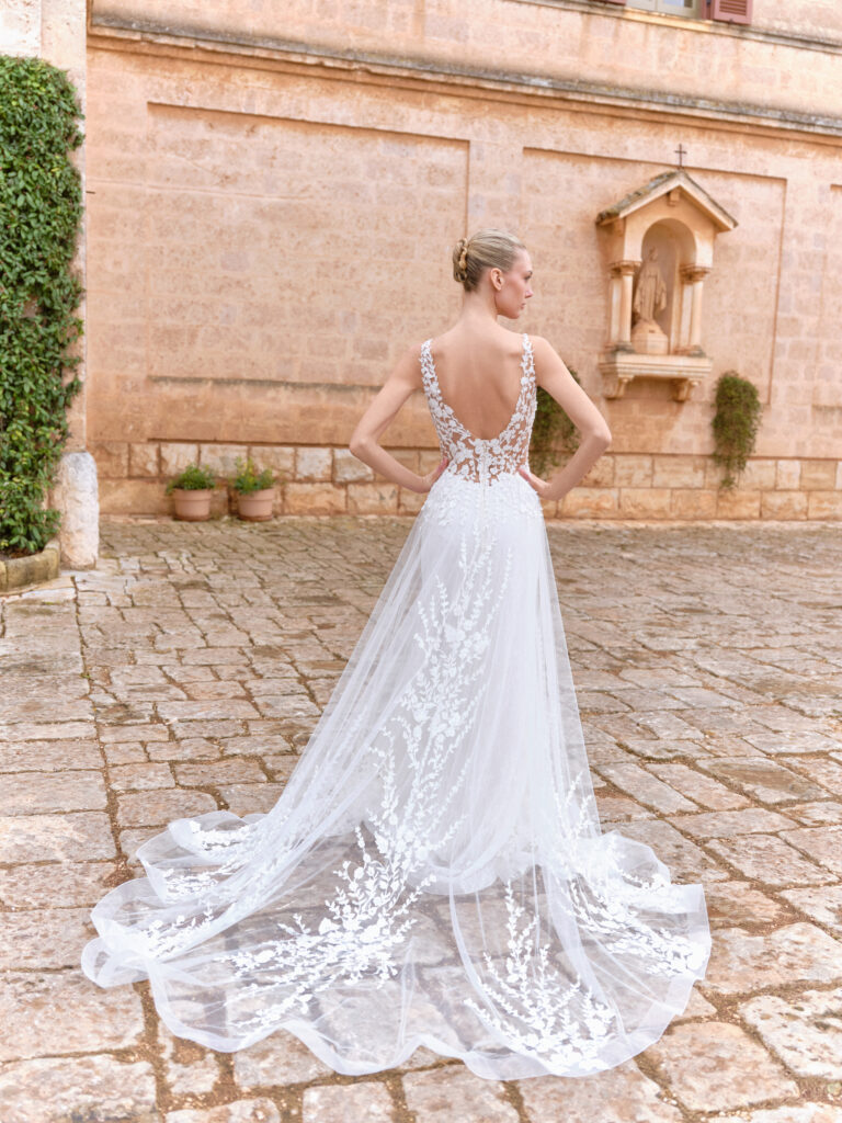 Dolce Amore wedding dress back view with low open back and tulle train