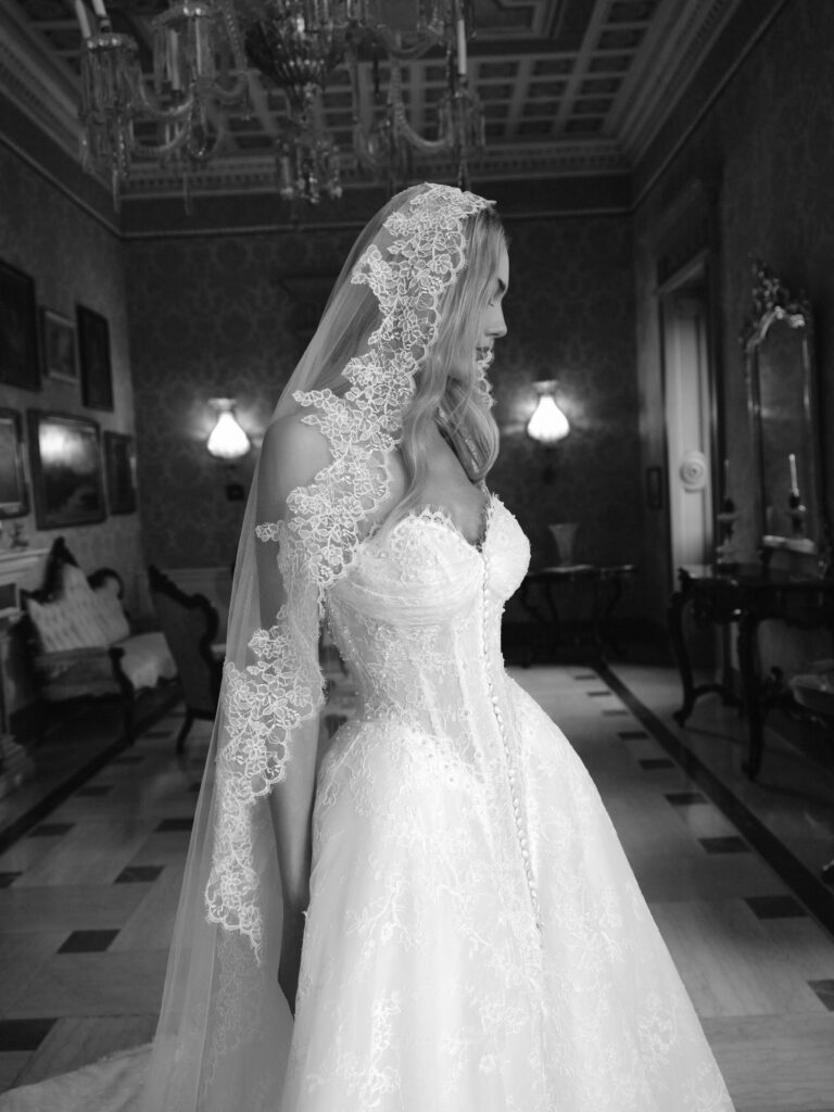 Affetto bridal gown close-up showing sweetheart neckline, lace bodice and button detailing