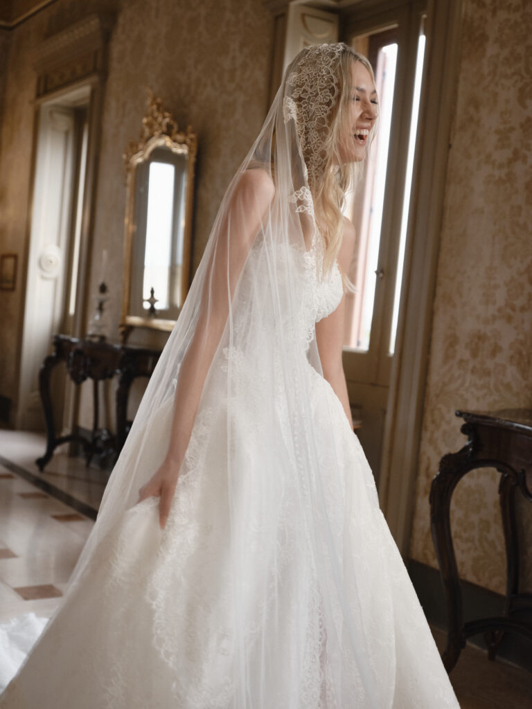 Affetto bridal gown angled view showing skirt volume and lace detailing