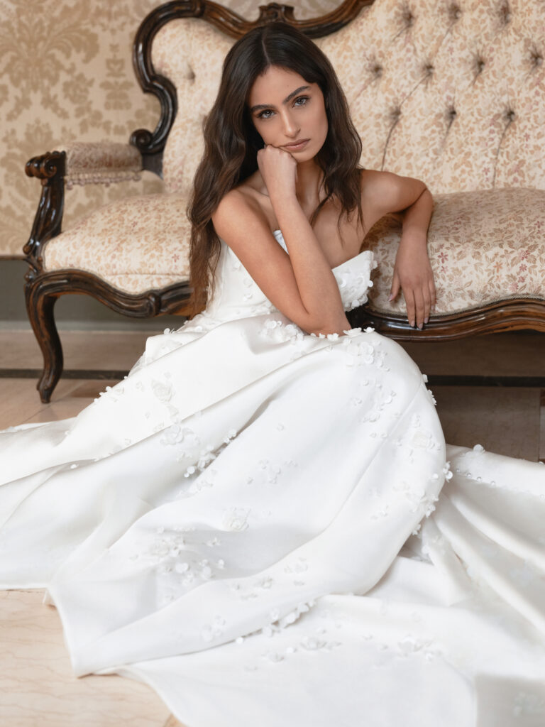 Mia Sposa bridal gown detail showing soft A-line skirt and scattered three-dimensional floral embellishment