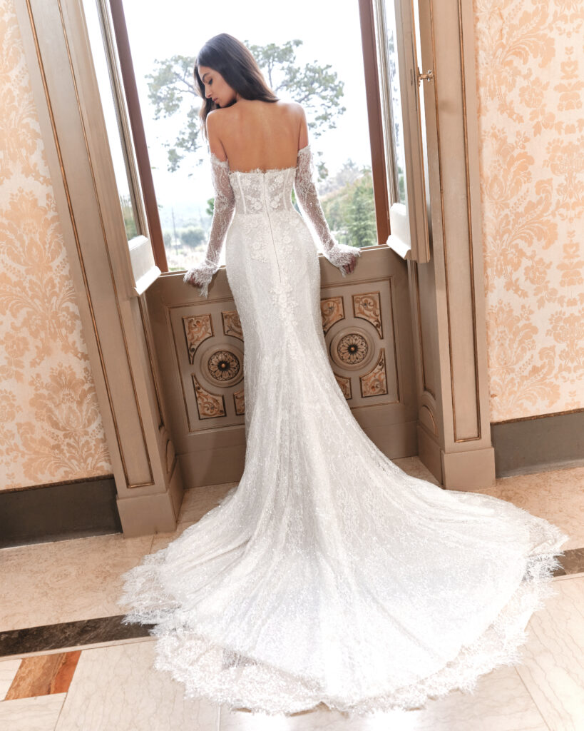Un Abbraccio bridal gown back view showing fitted silhouette and long train