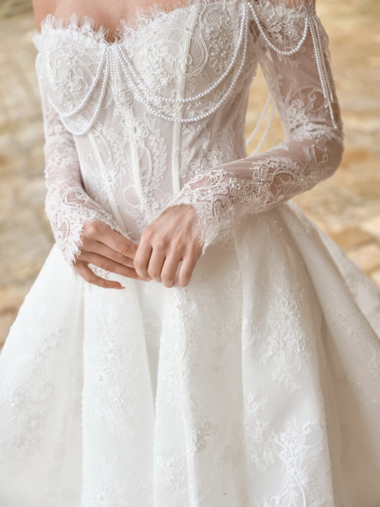 Amore Puro wedding dress close-up showing bodice structure and lace texture