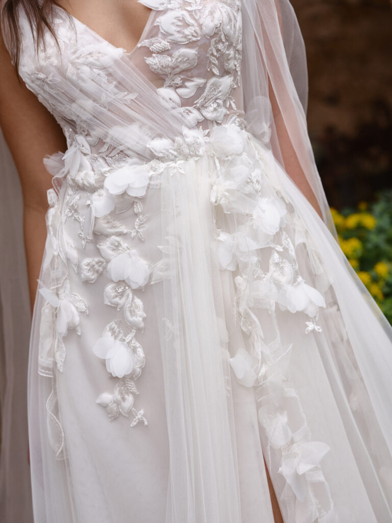 Tesoro Mia wedding dress floral appliqué detail on bodice and waist