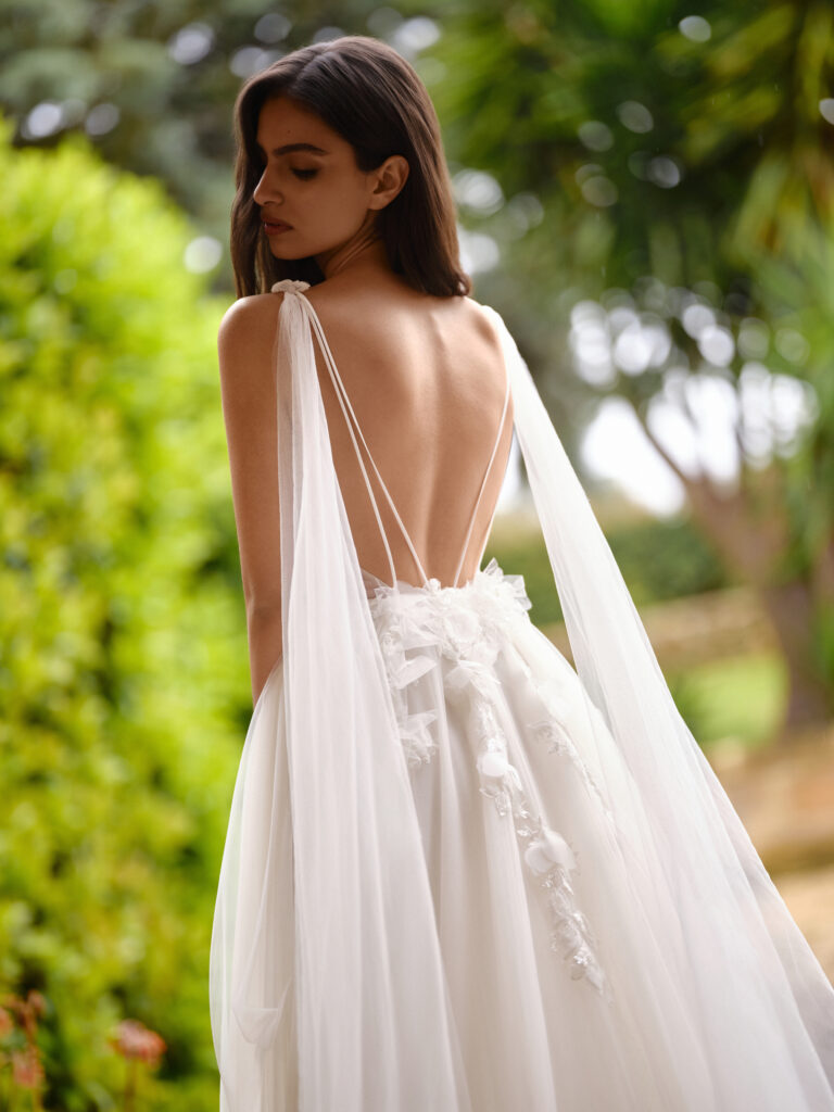 Tesoro Mia bridal gown back view with draped tulle wings and open back