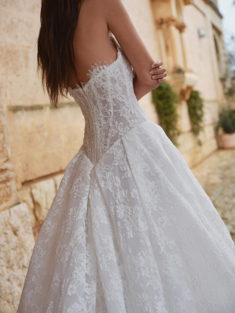 Romantica wedding dress side view showing lace bodice and full A-line skirt